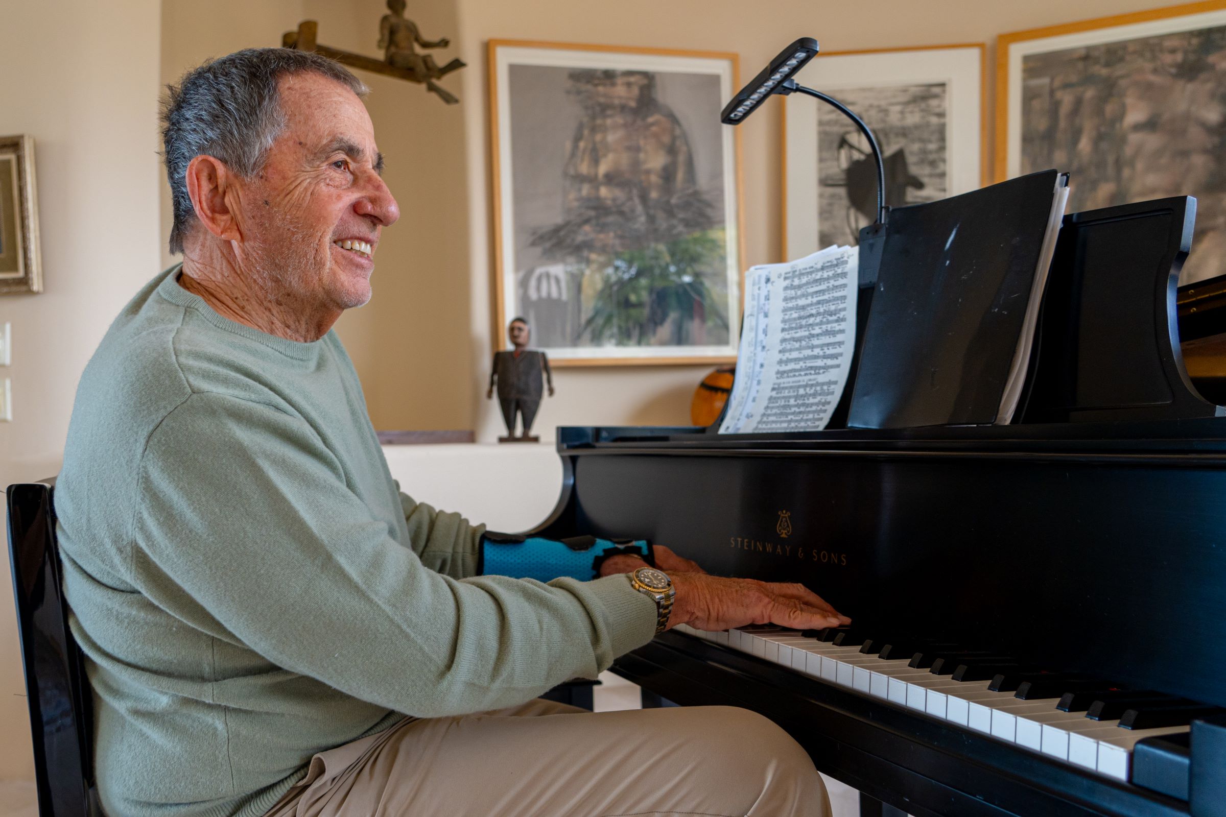 Photo of a man playing the piano.