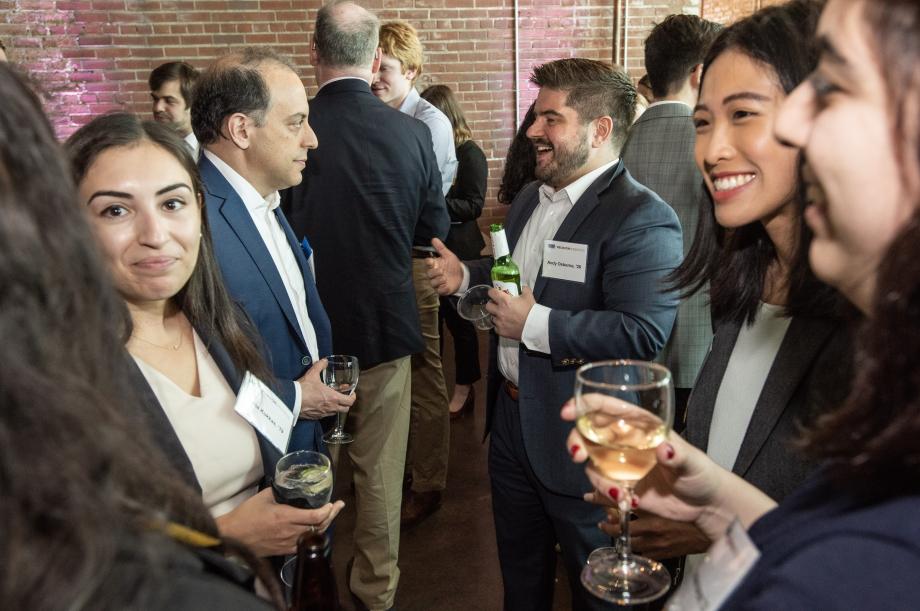 Alumni chatting at an event