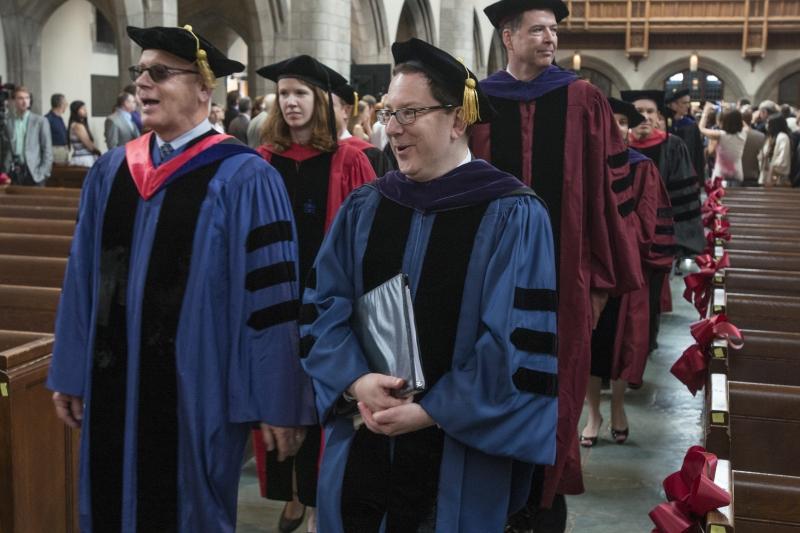 Faculty members begin the procession into Rockefeller Chapel.