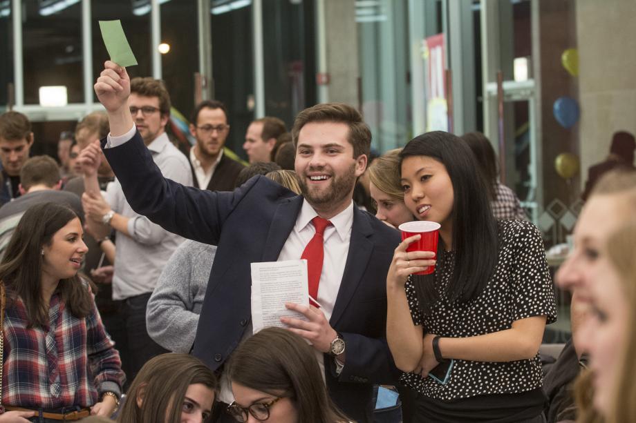That winter, members of the Class of 2018 attended their first CLF auction. The theme was "Carnival." Here, Andrew Hosea, '18, bids on an item during the live aucti