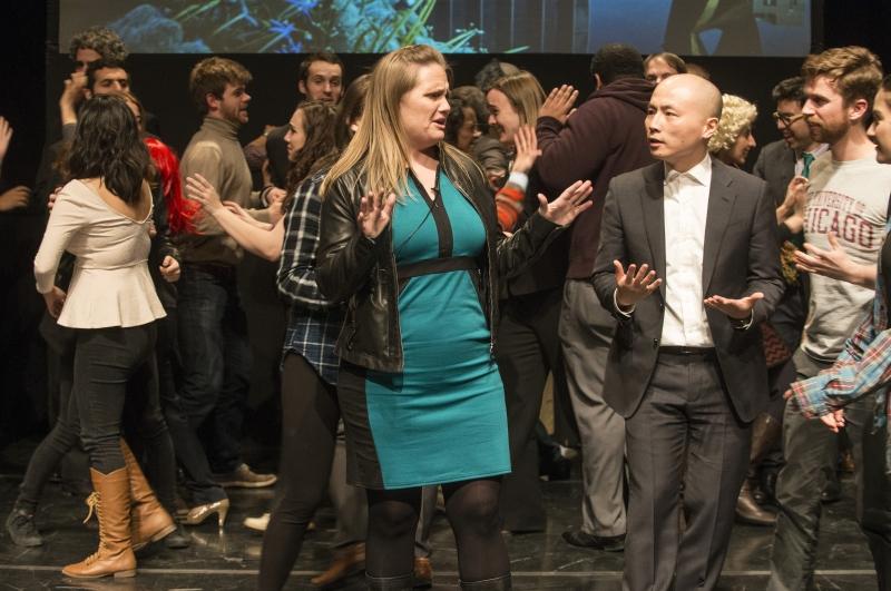 A student portrays Dean of Students Amy Gardner dealing with students yelling their concerns at her.