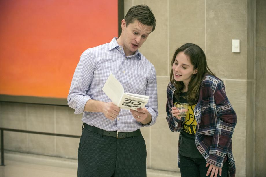 The 2017 CLF Auction had a 90's theme ("Bid Me Baby One More Time"). Here, Professor Anthony Casey reviews the auction program with Sami Bronner, '18.