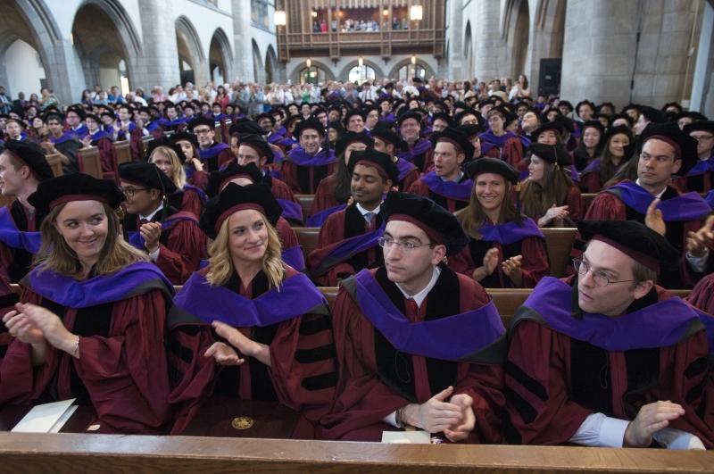 The Class of 2017 applauded in their hoods after the ceremony.