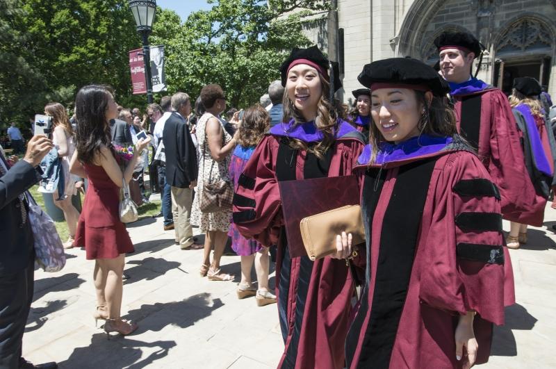 After the ceremony, graduates recessed from Rockefeller Chapel and made their way to the Law School.