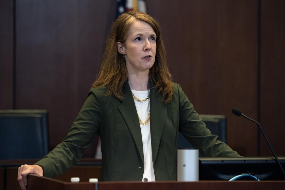 Woman standing at lectern