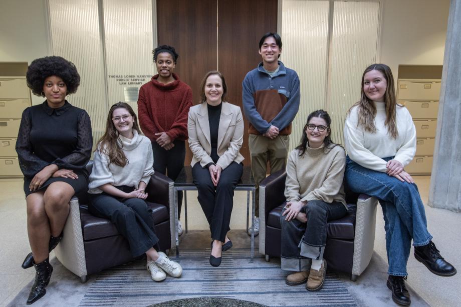 Erica Zunkel and her students seated together to pose for a photo.