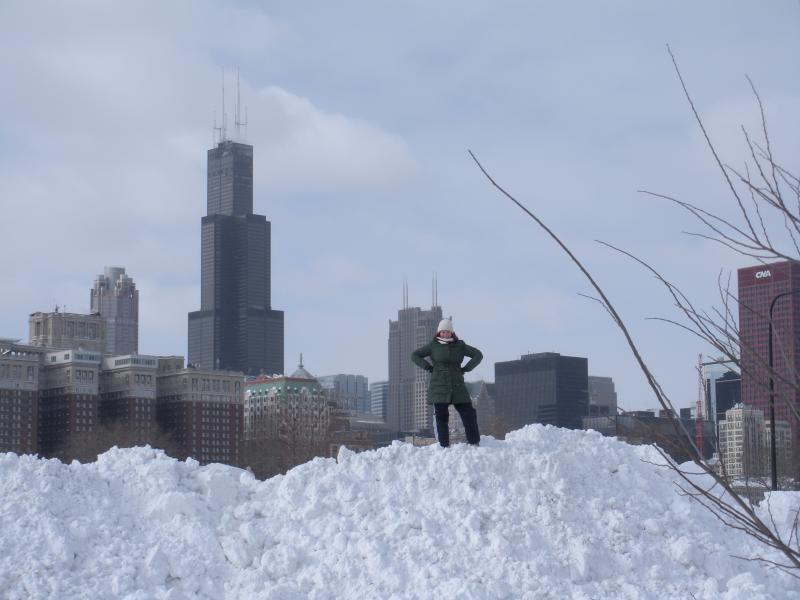 Kelly Albinak '11 atop a really, really big snow mound. 