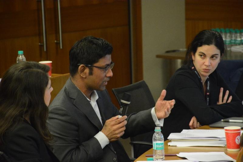 Aziz Huq, the Frank and Bernice J. Greenberg Professor of Law, speaks during a panel as Bigelow Teaching Fellow Dorothy Shapiro (left) and Assistant Professor of Law Laura Weinrib (right) look on.