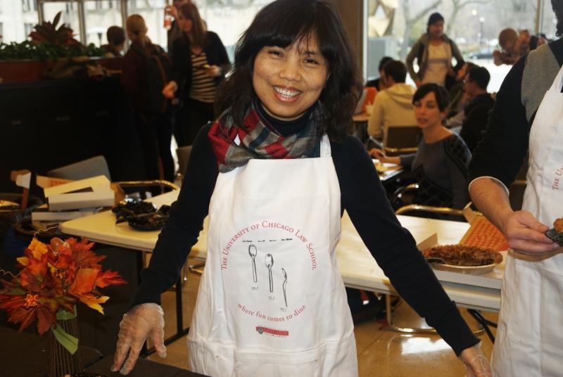 Aican Nguyen's apron says, "Where fun comes to dine." 