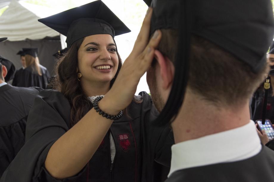  As they waited for the ceremony to begin, they chatted with classmates and helped each other prepare.