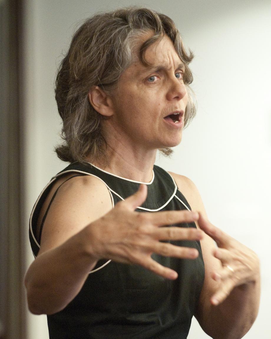 Professor Emily Buss speaks from the front of a classroom