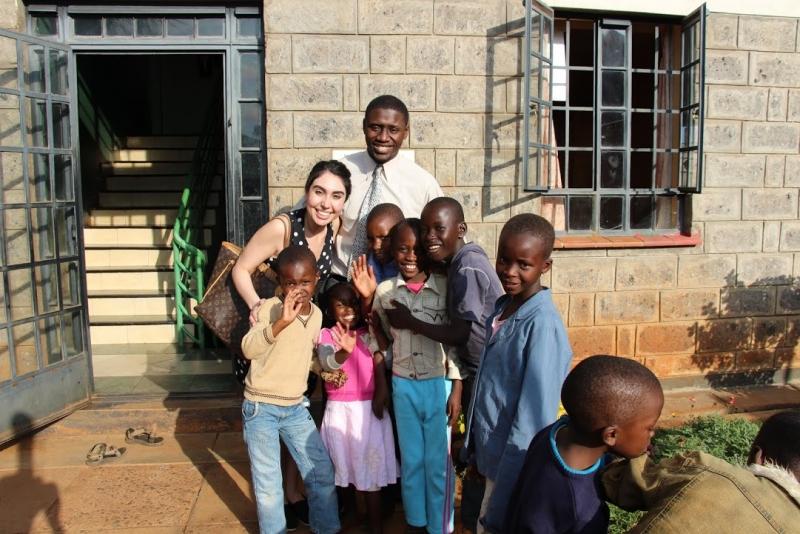 Shahrzad Daneshvar, '16, and Kevin Waklatsi, '14, with children at an orphanage.