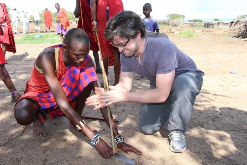 John Sprangers, '14, worked to start a fire in a Maasai village. 