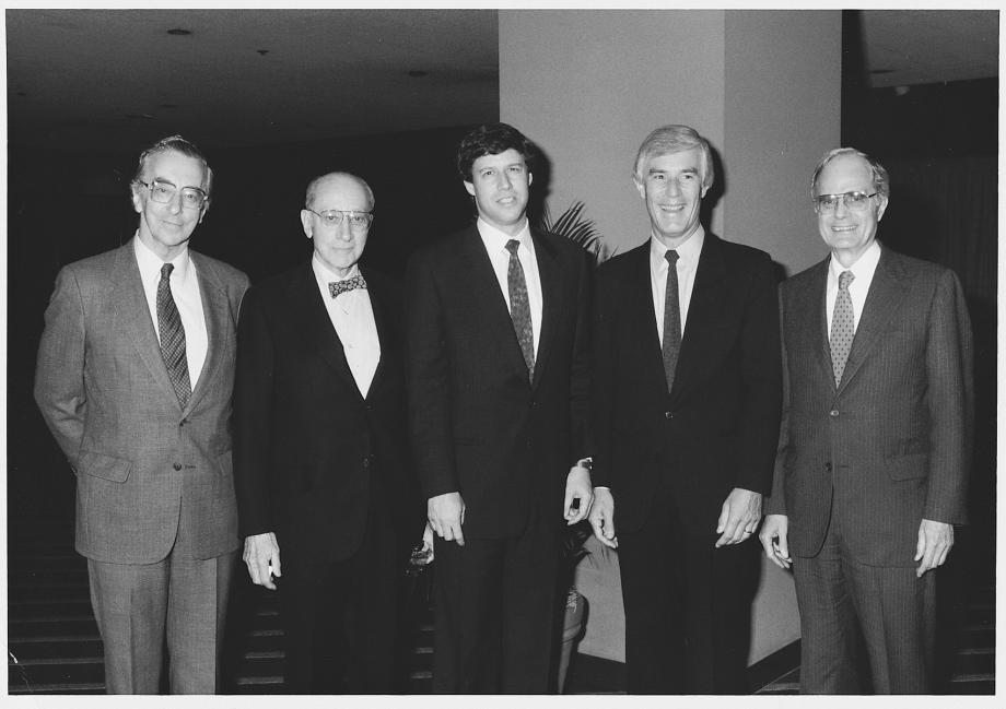 Geoffrey Stone (center) with former deans of the Law School (left to right): Norval Morris, Edward H. Levi, Gerhard Casper, and Phil C. Neal, circa 1990. Five men in suits stand next to each other