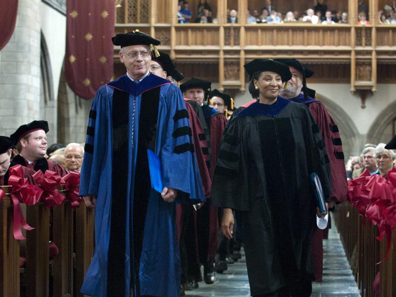 Dean and William B. Graham Professor of Law Saul Levmore, and Dean of Students Michele Richardson lead the faculty procession into Rockefeller Chapel for the Hooding Ceremony.