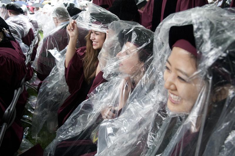 Student wearing poncho at commencement