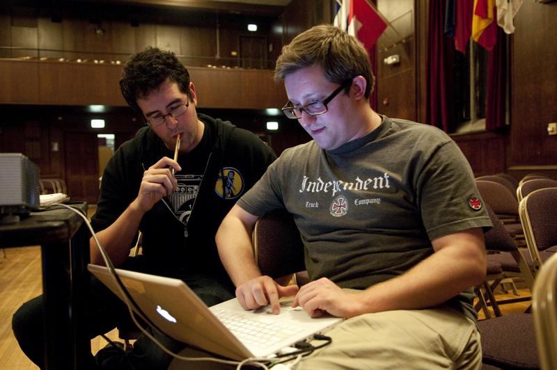 Evan Berkow, '11, checks the digital clips that will be projected to a large screen.