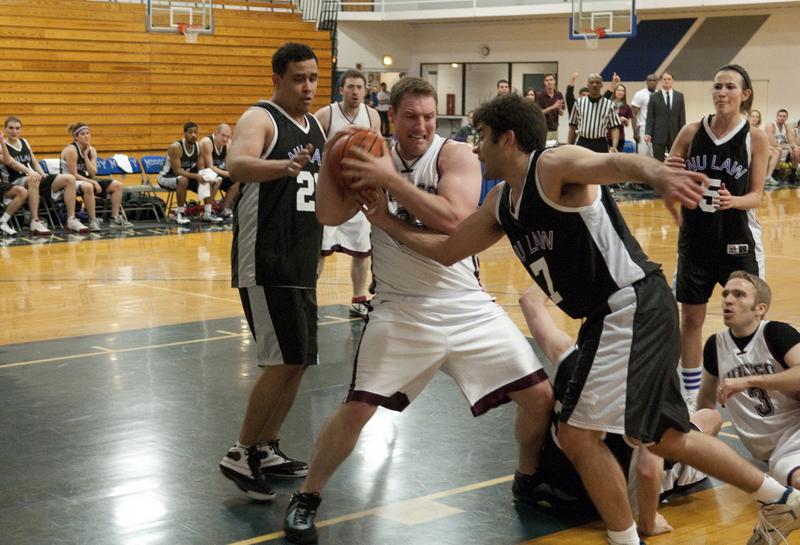 Nathanael Paynter, '12, wrestles the ball from an opponent.