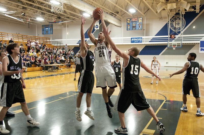 Caleb Hanlon, '13, tries to score against two Northwestern players.