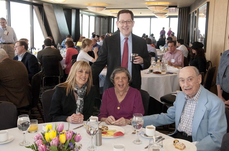 Dean Michael Schill with alumni at brunch.