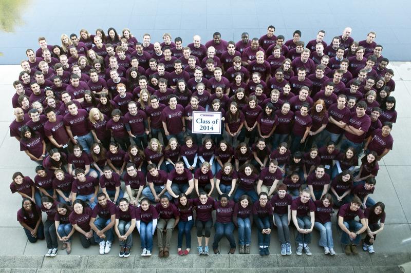 The Class of 2014 poses for a group photo by the reflecting pool.