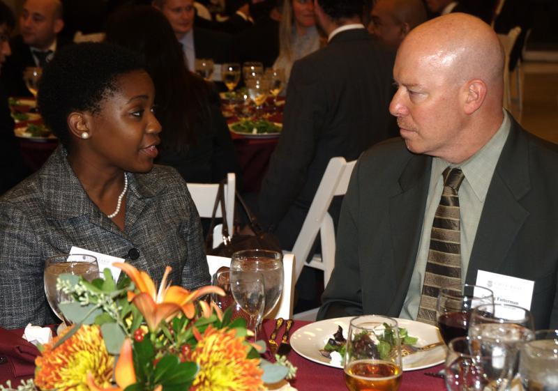 Clinical Professor Craig Futterman and a student at dinner. Clinical Professor Craig Futterman and a student at dinner.