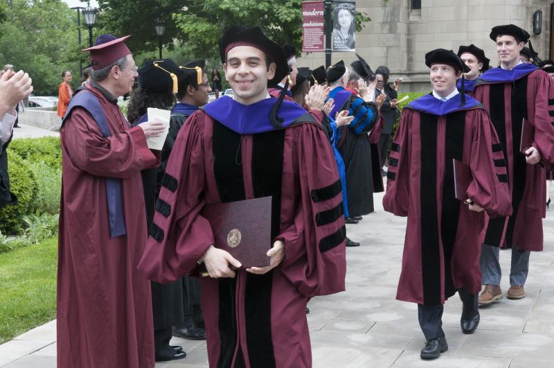 Students left Rockefeller with their diplomas, their hoods, and big smiles.