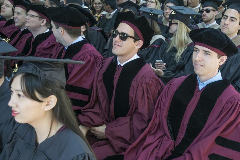 JDs listen to speakers during the convocation for all degree earners.