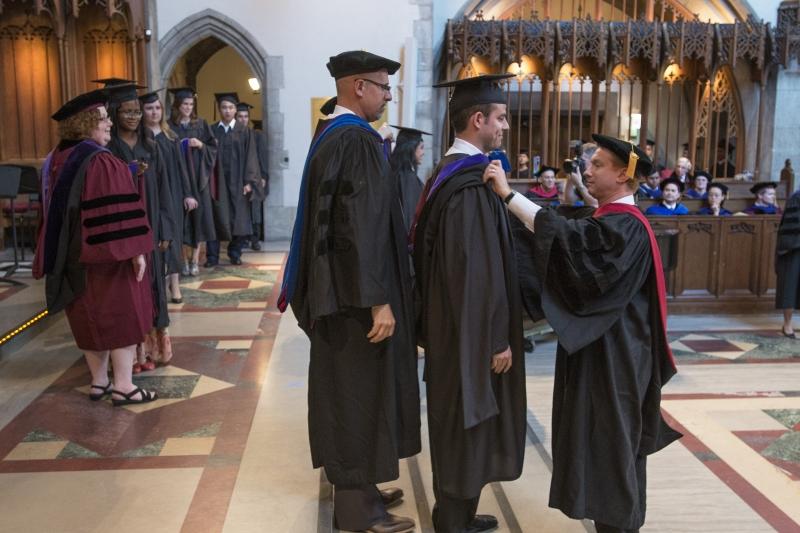 Professors Tom Ginsburg and Jonathan Masur were faculty hooders.