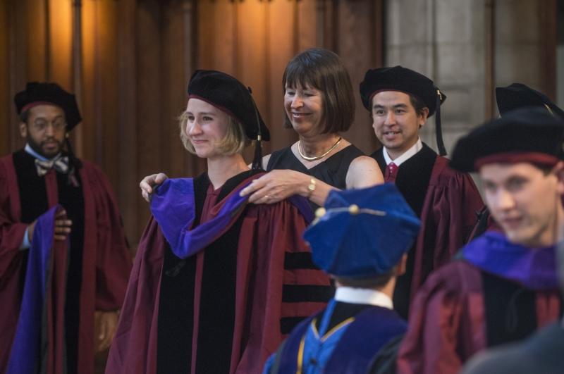 Stephanie Yesnik was hooded by her mother, Karen Jo Ward, '80. 