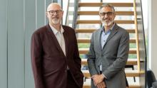 Tom Ginsburg with Tony Banout standing in front of a staircase