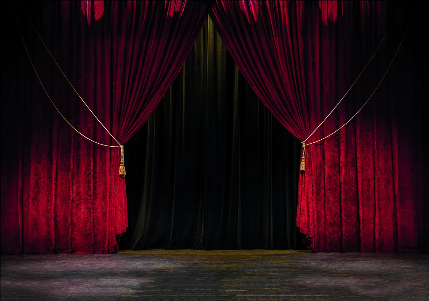 A dramatic rendering of red curtains on a stage.